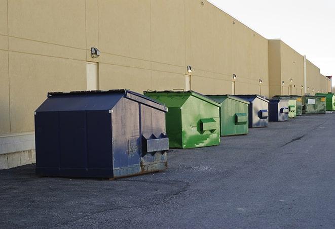 an aerial view of construction dumpsters placed on a large lot in Blue Ash